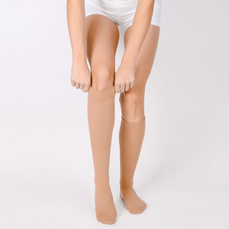 Medical compression stockings for varicose veins and venouse therapy. compression hosiery. sock for sports isolated on white background.