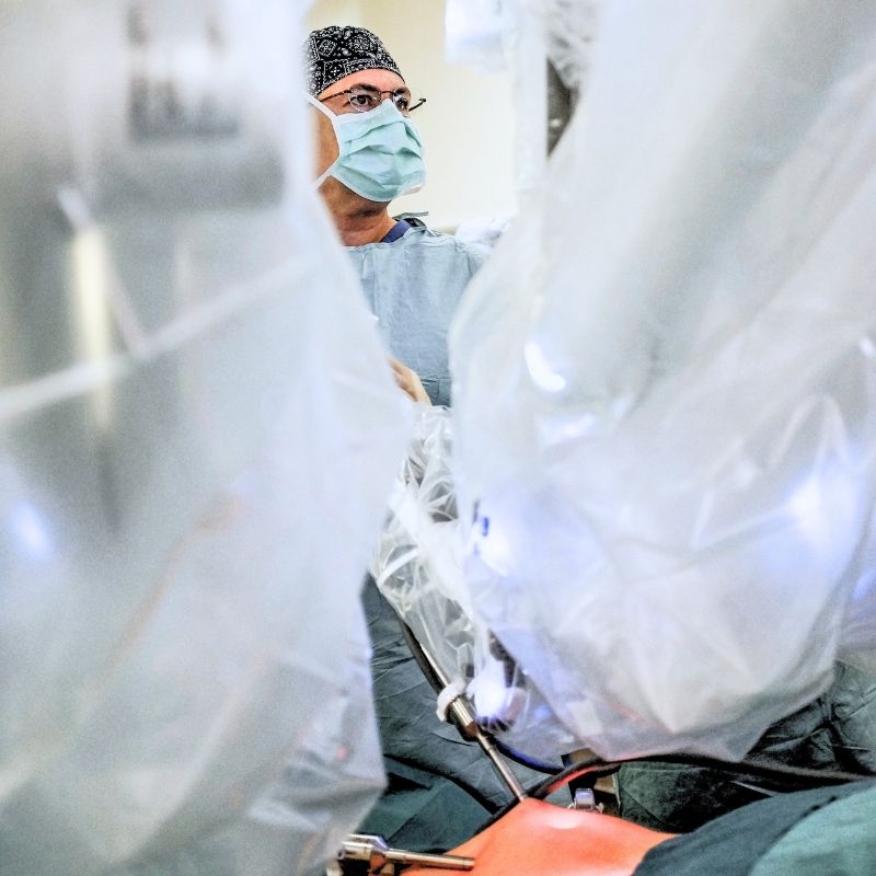Dr Inan operating with the robotic surgical system in the operating room during abdominal wall surgery.