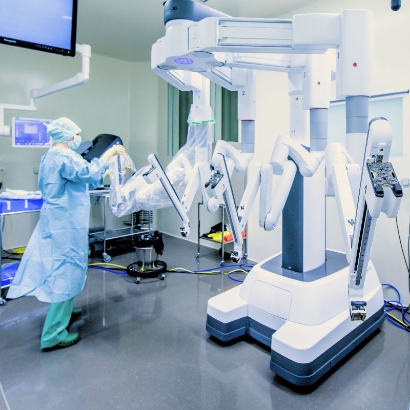 Nurse preparing the robotic surgical system in the operating room before minimally invasive ventral hernia repair.