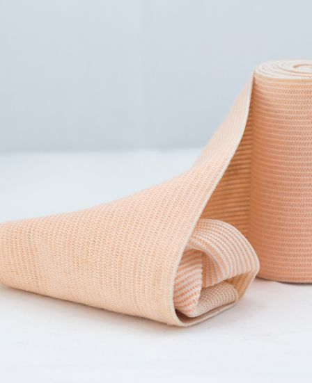 Graduated compression bandage applied to the legs to support circulation and reduce the risk of thrombosis after abdominal surgery.